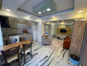 Economy Apartment | Living area | 32-inch LCD TV with cable channels, TV - Garden Butik & Apart Hotel Akbuk (Didim)