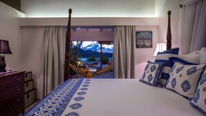 A hotel room with a large bed, a view of the sea, and a hammock. - Villa Sas Luxury villa (Saint Jean)