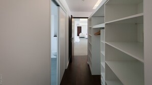A modern hallway with a built-in closet and a view into a living area. - Cairn (3/4 Rooms) Luxury villa (Petit Cul de Sac)