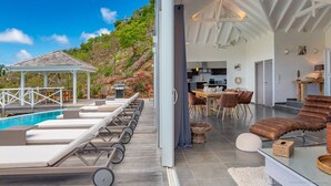 A modern villa with a pool, outdoor seating, and a dining area. - Beautiful Azetes Luxury villa (Vitet)