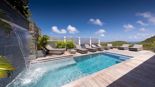 A pool area with lounge chairs and a waterfall feature. - Lenalee (1/4 Rooms) Luxury villa (Gustavia)