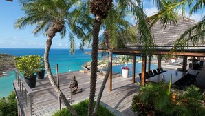 A wooden deck with a pool, lounge chairs, and a Buddha statue. - Jade (4/8 Rooms) Luxury villa (Marigot)
