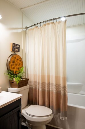 Combined shower/tub, hair dryer, towels, toilet paper