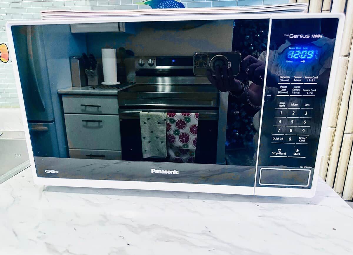 A Panasonic microwave oven with a digital display and control buttons.