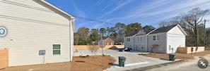 Houses with simple, functional design and front yards.