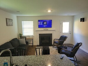 Smart TV, fireplace, books