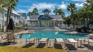 A pool area with lounge chairs and a covered pavilion. - Perfect beach getaway! Bike to beach, pool - 4 cruisers included! (Rosemary Beach)