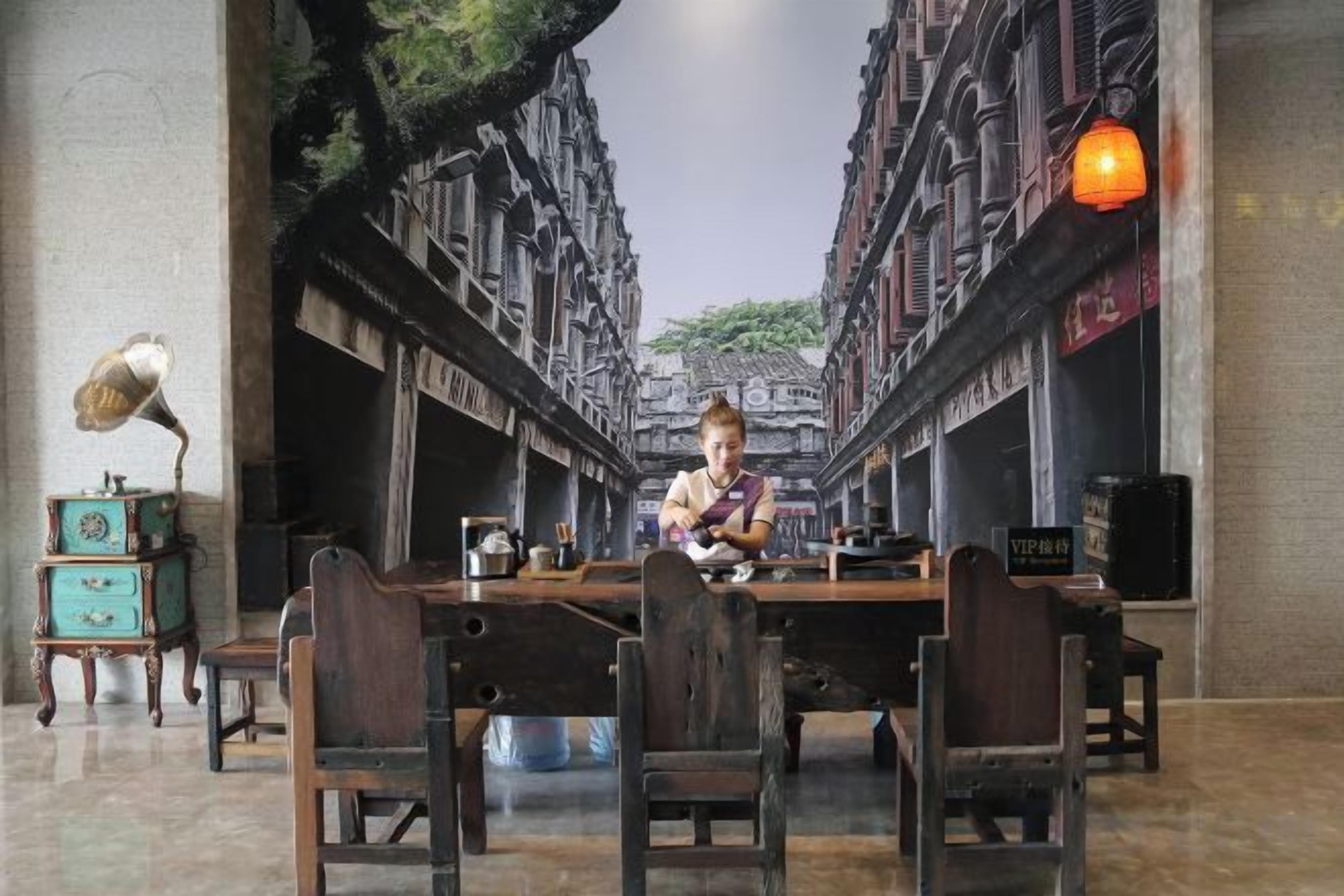 A dining area with a table, chairs, and a lamp.