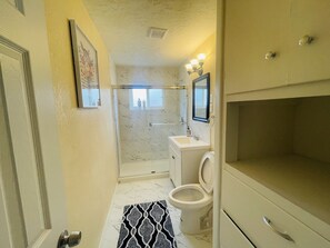 Bathtub, hair dryer, towels, soap