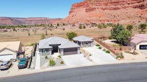 A residential area with houses, a garage, and a driveway.