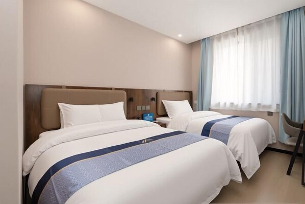 A hotel room with two beds, a nightstand, a chair, and a window with curtains. - Aifeel Hotel (Beijing Lishuiqiao Subway Station) (Beijing)