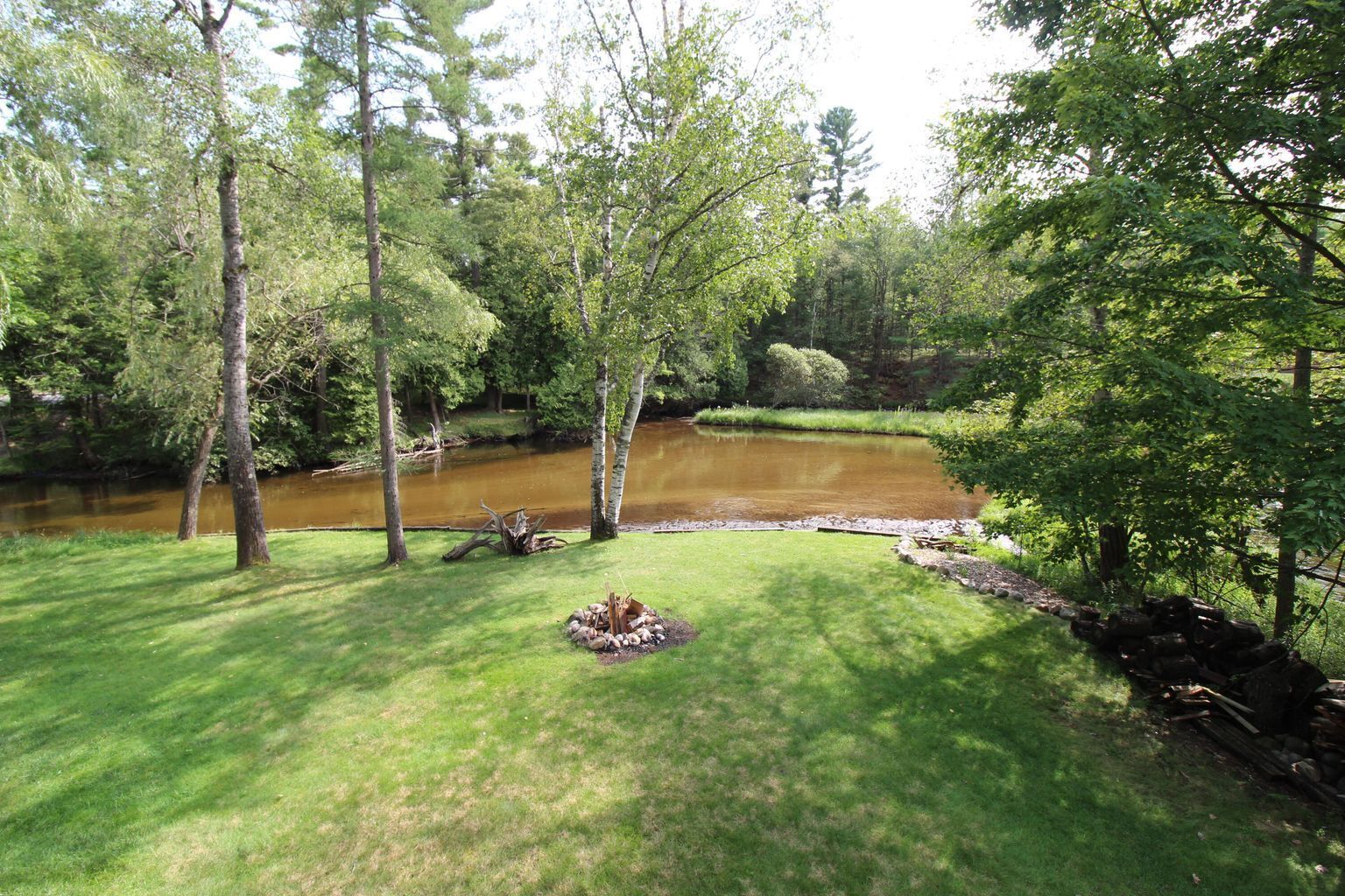 Relax, Unwind and Enjoy.  Rustic log cabin with private Au Sable River Frontage!