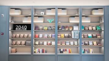 A bookshelf with books and a sign that reads '2040 BOOKSTORE.'