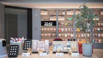 A bookstore with shelves of books and a display of various items.