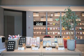 A bookstore with shelves of books and a display of various items. - Ji Hotel (future Road Store, Convention & Exhibiti (Zhengzhou)