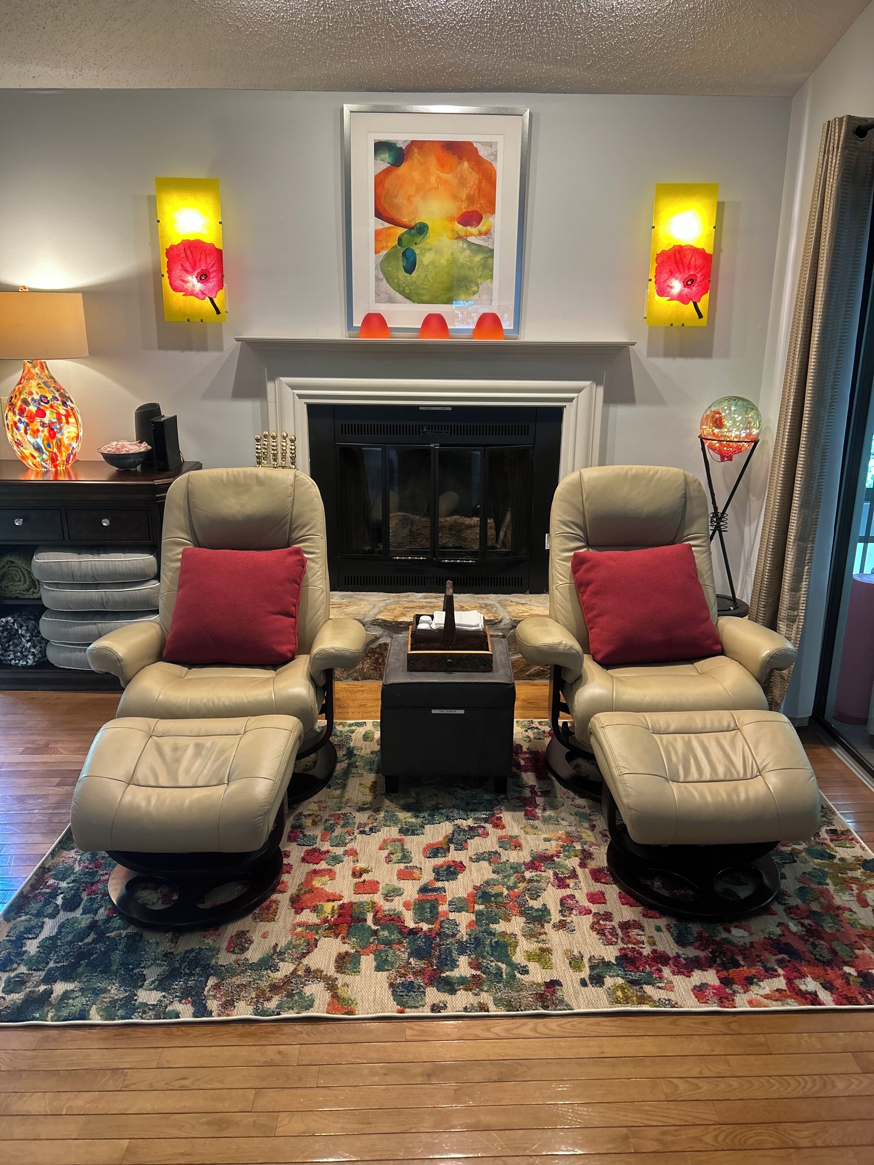 Updated pic of rug in living room by fireplace.
