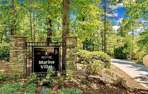 Surrounded by lush greenery and tall trees, Marina Villas offers a serene setting.