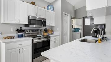 Microwave, dishwasher, coffee/tea maker, cookware/dishes/utensils