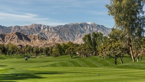 A golf course with a mountainous backdrop, trees, and a clear sky. - Marriott's Desert Springs Villas II - STUDIO + Kitchenette + Full Bath  SLEEPS 4 (Palm Desert)