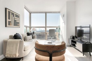 TV, stereo - Modern Hoboken 2BR w/ Doorman, Gym & W/D, near shuttle, by Blueground (New Jersey)