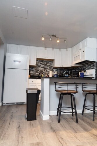 Nchanted 1BR Luxury Retreat near Airport and Sports Complex w/ Yard and Parking