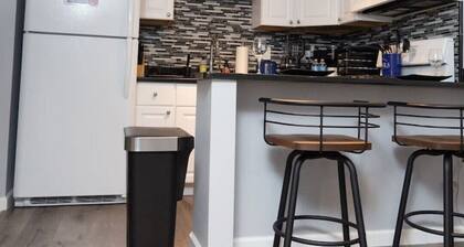Nchanted 1BR Luxury Retreat near Airport and Sports Complex w/ Yard and Parking
