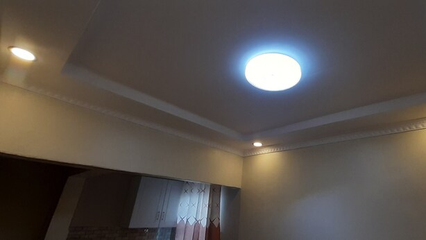 A room with a recessed ceiling light, a white ceiling with decorative molding, and a partial view of a wardrobe. - Lena Cottage - 10km from Nanyuki Town towards Timau (Nanyuki)