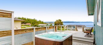 Updated Water View Gem with Deck, BBQ/Outdoor Dining, Hot Tub, Fireplace, & WiFi