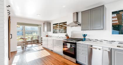 Updated Water View Gem with Deck, BBQ/Outdoor Dining, Hot Tub, Fireplace, & WiFi