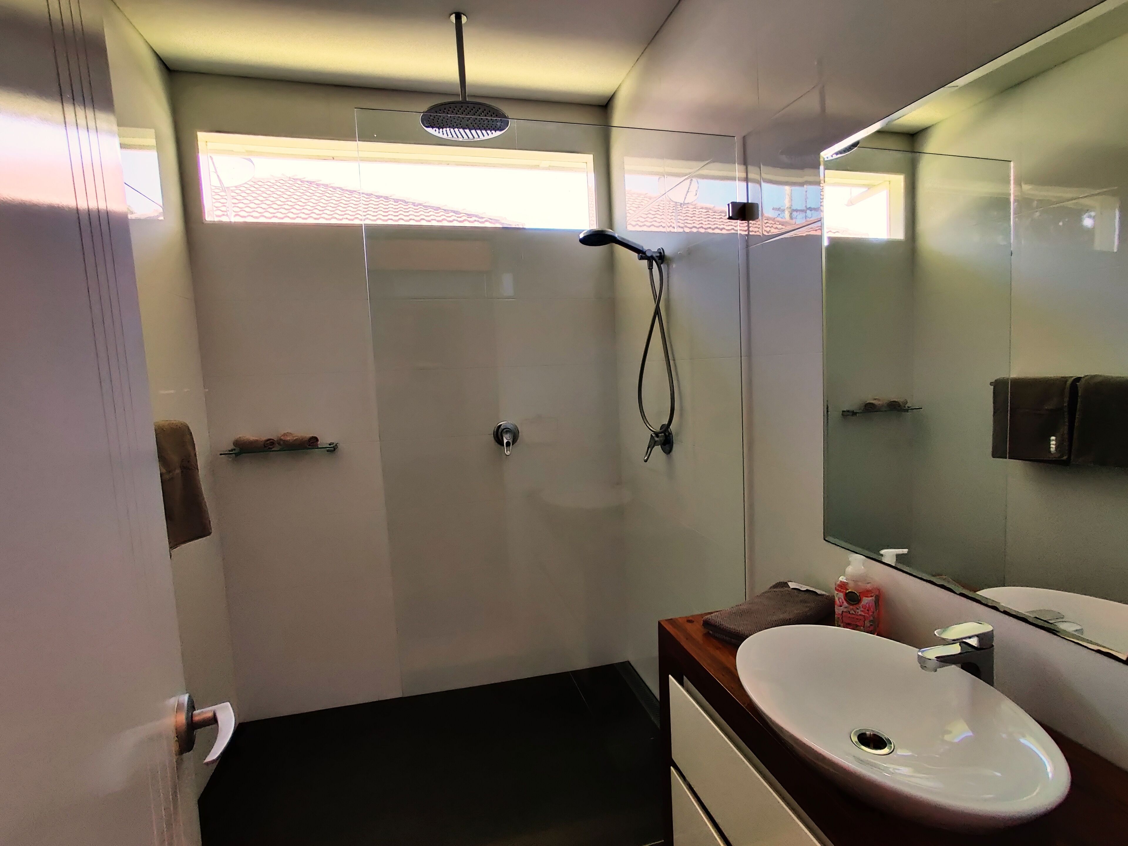 Shower, rainfall showerhead, hair dryer, towels
