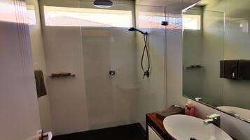 Shower, rainfall showerhead, hair dryer, towels
