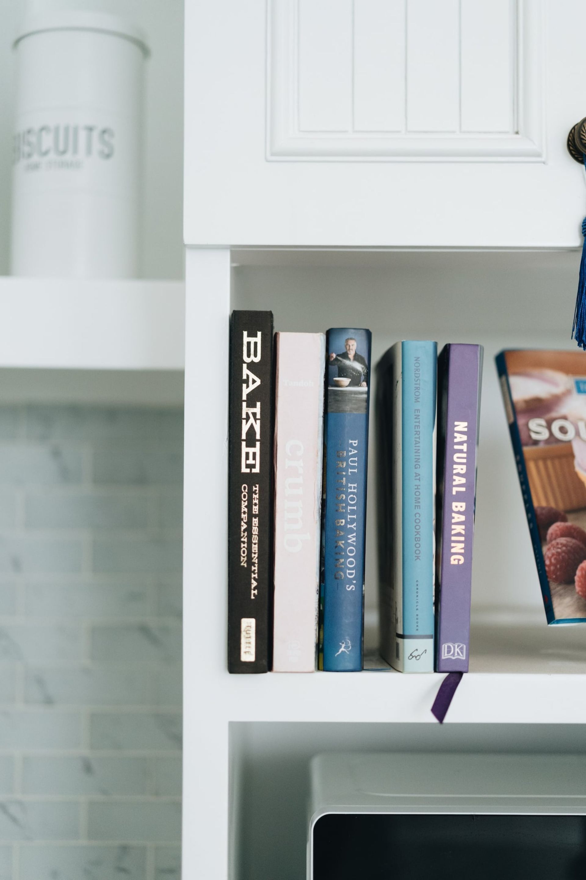 A bookshelf with books on baking.