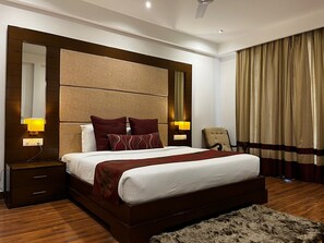 In-room safe, desk, laptop workspace, soundproofing - Yuhi Suites (Gurugram)
