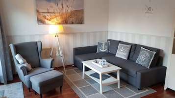 Comfort Apartment | Living area | 32-inch flat-screen TV with satellite channels, TV