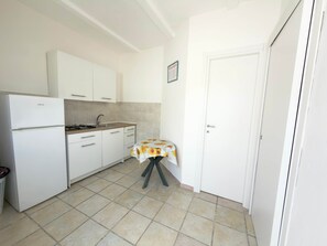 Fridge, stovetop, cookware/dishes/utensils