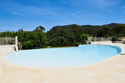 Charming residence with waterfront pool.