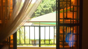A room with a sliding door leading to a balcony. - Mukoma Heights (Nairobi)