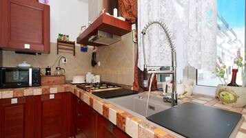 Apartment (Three bedroom apartment with Sea view) | Private kitchen | Fridge, coffee/tea maker, electric kettle