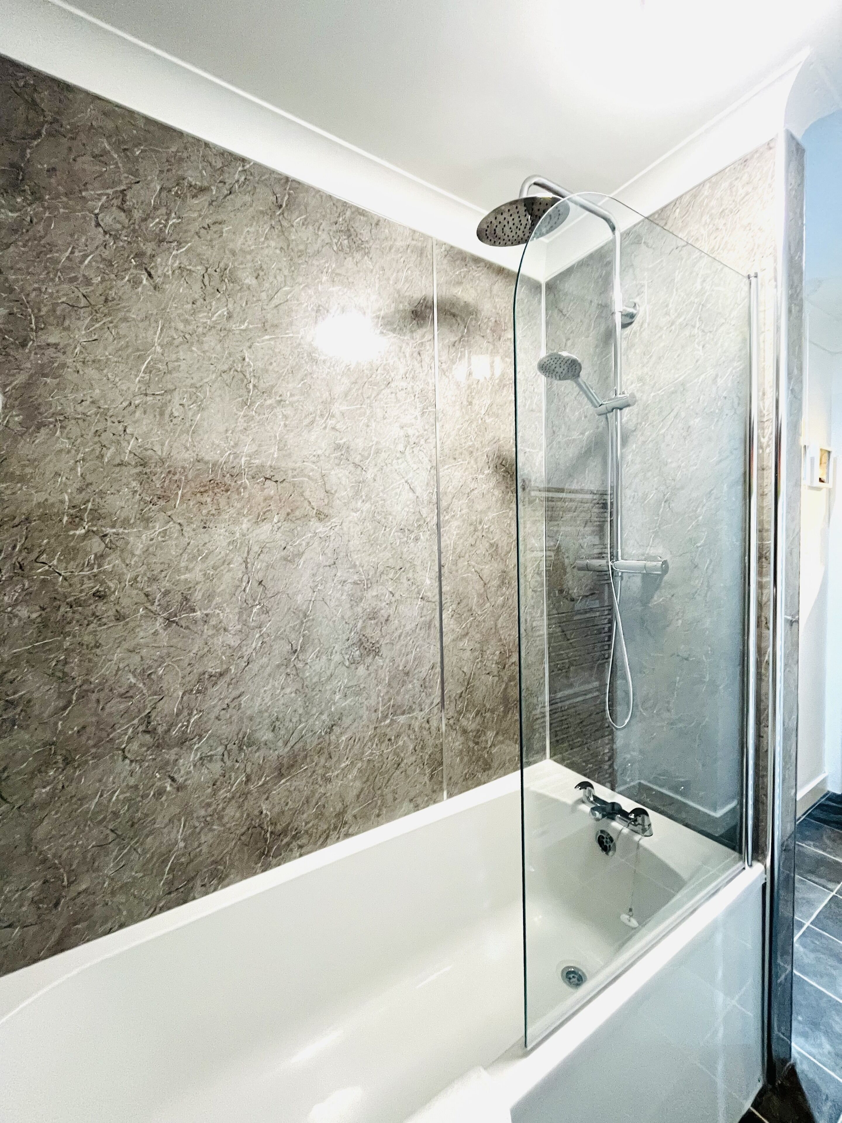 Combined shower/bathtub, hair dryer, towels, soap