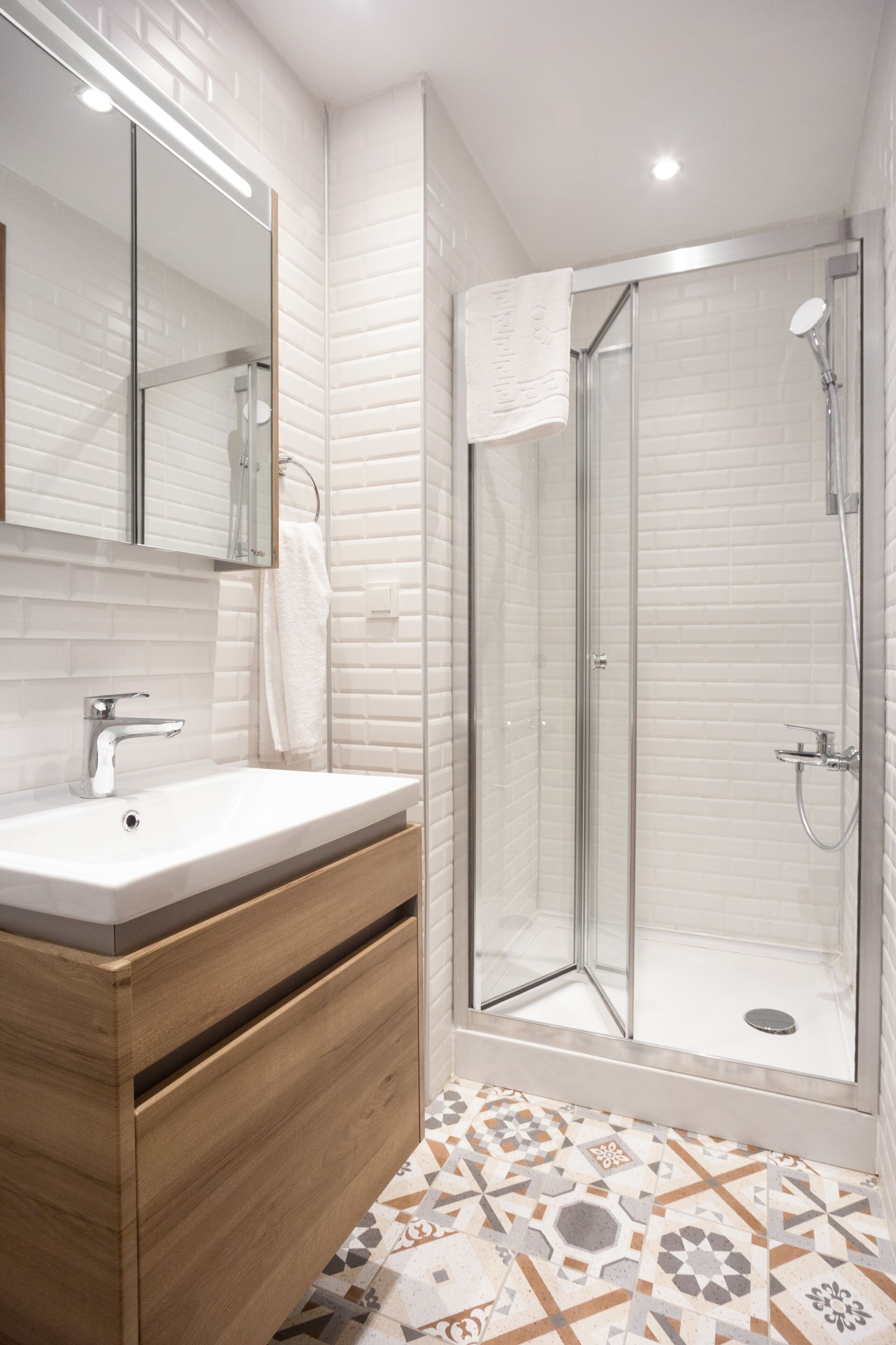Shower, hair dryer, slippers, towels