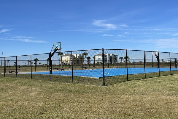 Full size basketball court with corn hole for loads of family fun.