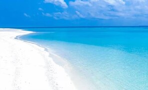 A beach with clear turquoise water and white sand. - Experience Jungle and Beach living @ Selva Escondida (Puerto Morelos)