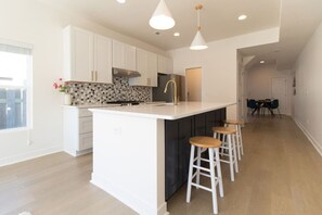 Enjoy meals in this well-equipped kitchen with a central island and dining area.