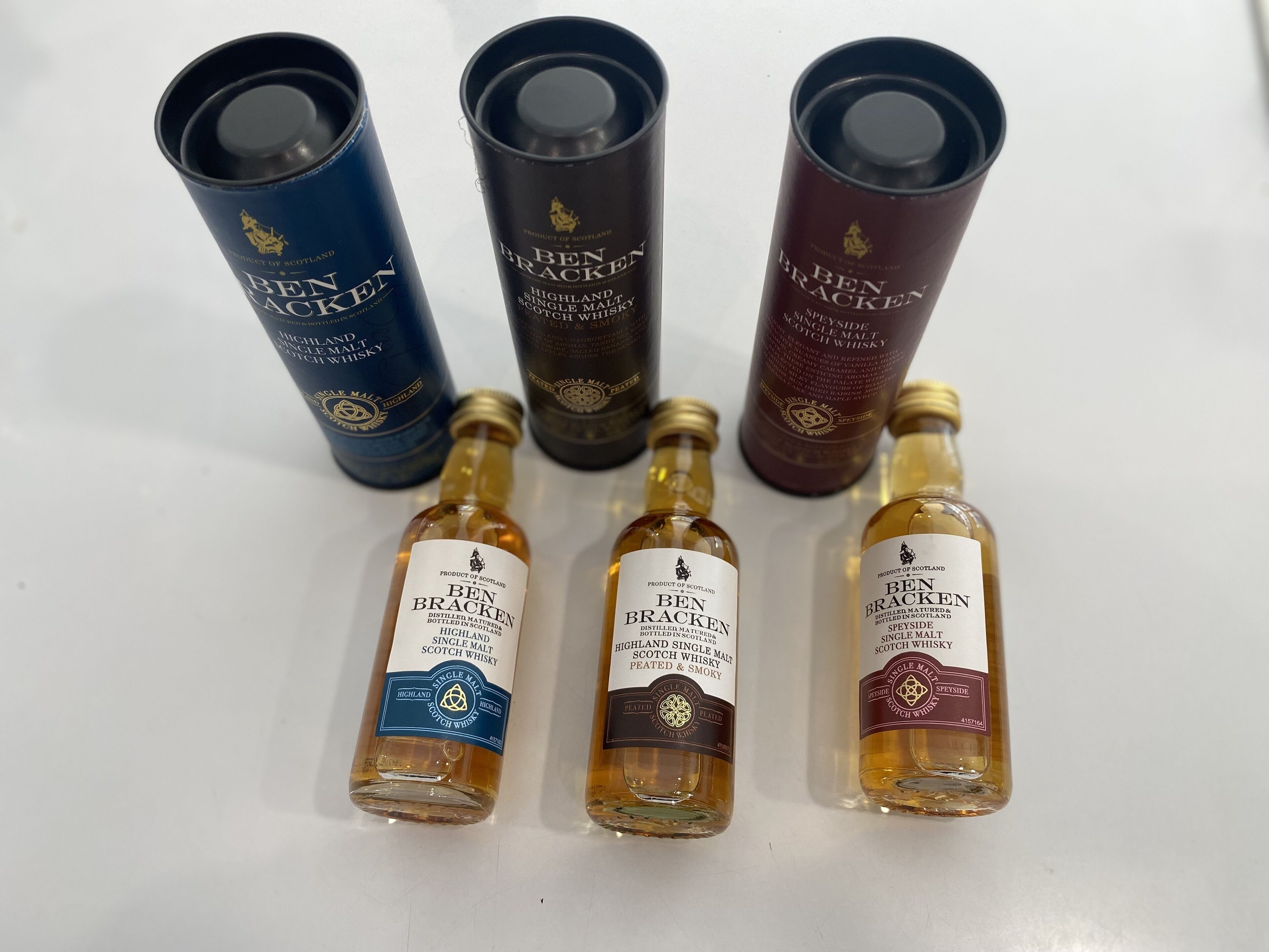 Four bottles of Ben Bracken whisky, each with a distinct label design.