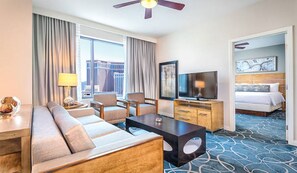 Relax in a stylish room with a large bed, flat-screen TV, and comfortable seating area.