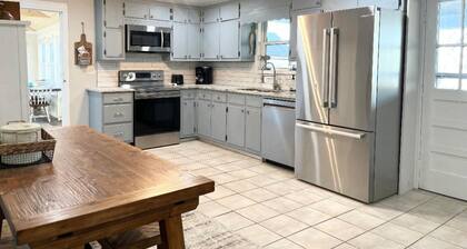 Waterfront home for 12: pets welcome, covered deck, boat slip, beach area, grill