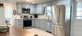Waterfront home for 12: pets welcome, covered deck, boat slip, beach area, grill