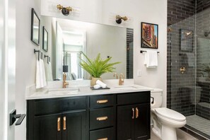 Shower, hair dryer, towels, shampoo