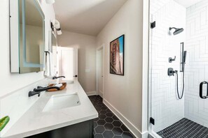 Shower, hair dryer, towels, shampoo