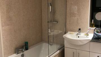 Combined shower/tub, hair dryer, towels, soap